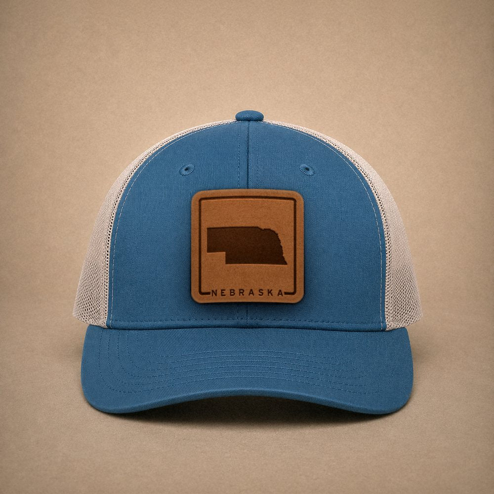 Steel Blue Nebraska hats — Nebraska Outline Leather Patch Trucker Hat