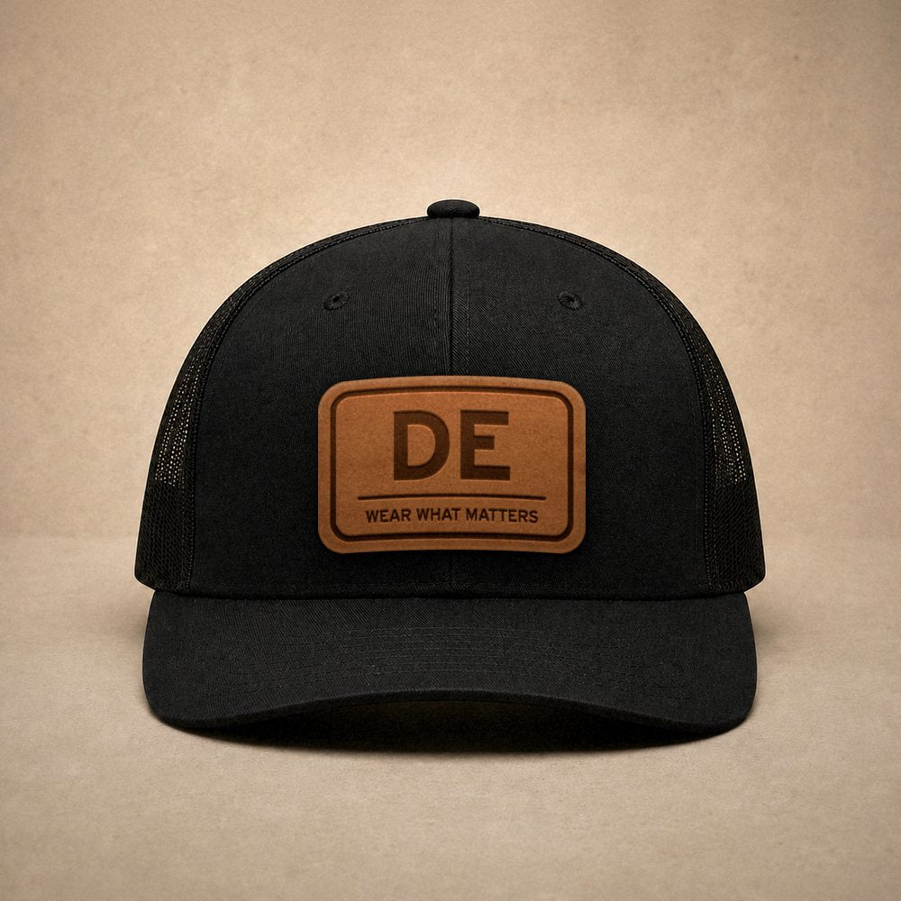 Black Delaware hats — Delaware DE Leather Patch Trucker Hat