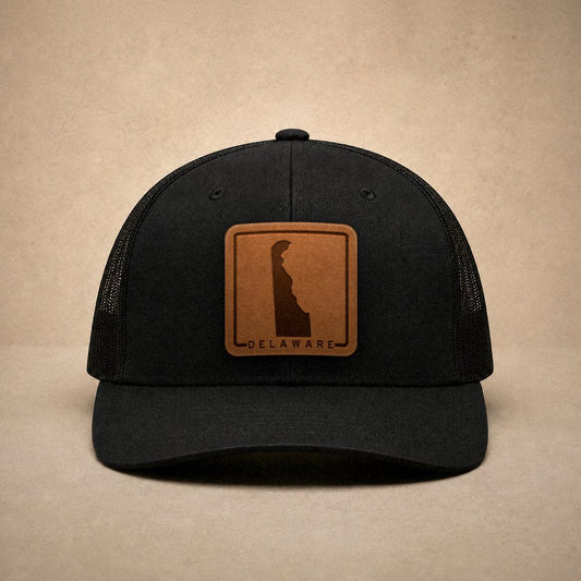Black Delaware hats — Delaware Outline Leather Patch Trucker Hat