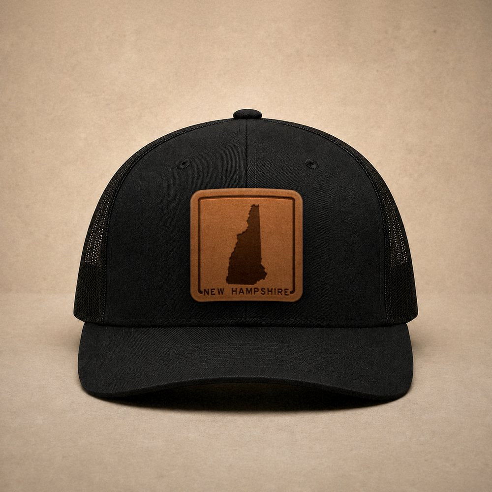 Black New Hampshire hats — New Hampshire Outline Leather Patch Trucker Hat
