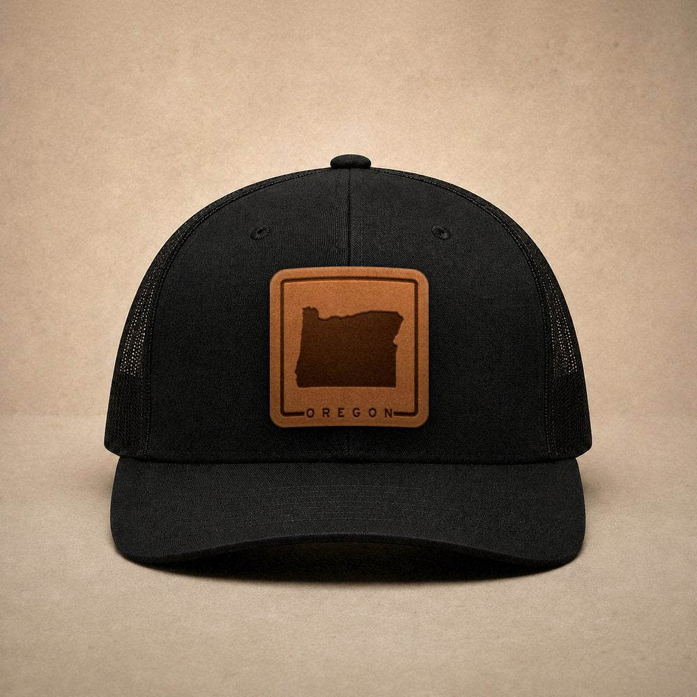 Black Oregon hats — Oregon Outline Leather Patch Trucker Hat