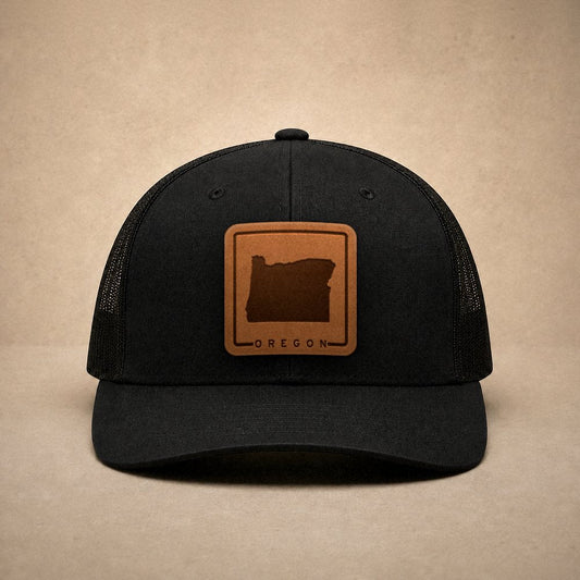 Black Oregon hats — Oregon Outline Leather Patch Trucker Hat