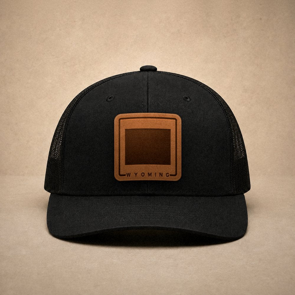 Black Wyoming hats — Wyoming Outline Leather Patch Trucker Hat