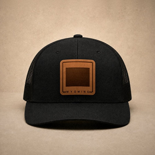 Black Wyoming hats — Wyoming Outline Leather Patch Trucker Hat