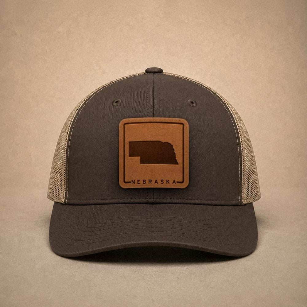 Brown Nebraska hats — Nebraska Outline Leather Patch Trucker Hat
