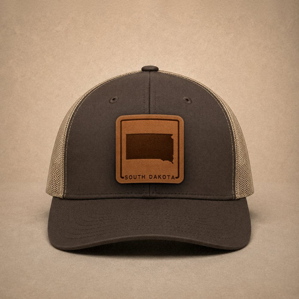 Brown South Dakota hats — South Dakota Outline Leather Patch Trucker Hat