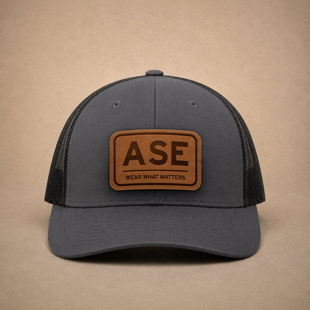Charcoal Aspen hats — Aspen ASE Leather Patch Trucker Hat