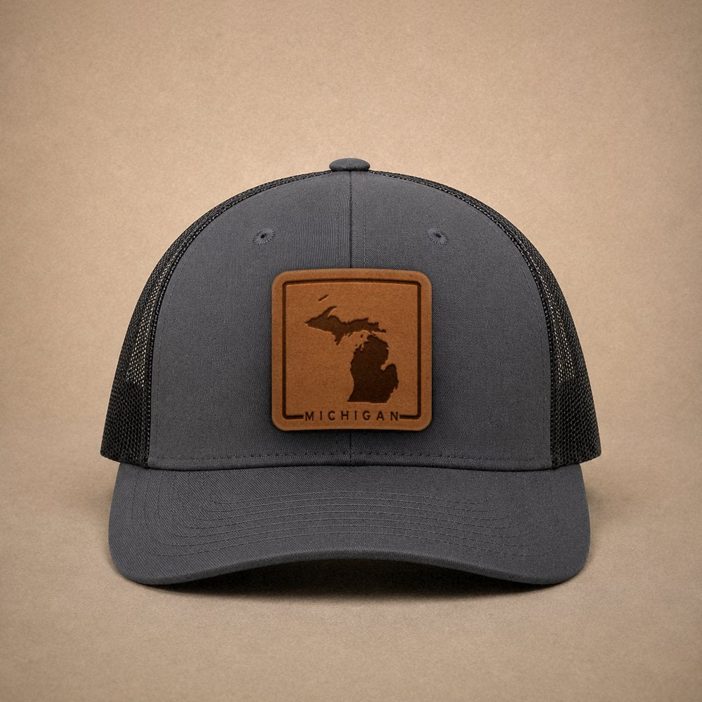 Charcoal Michigan hats — Michigan Outline Leather Patch Trucker Hat