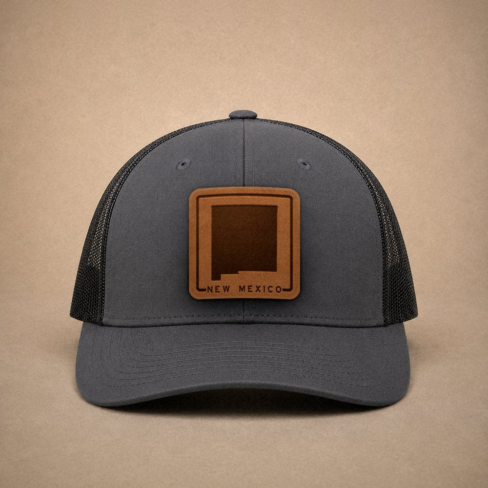 Charcoal New Mexico hats — New Mexico Outline Leather Patch Trucker Hat