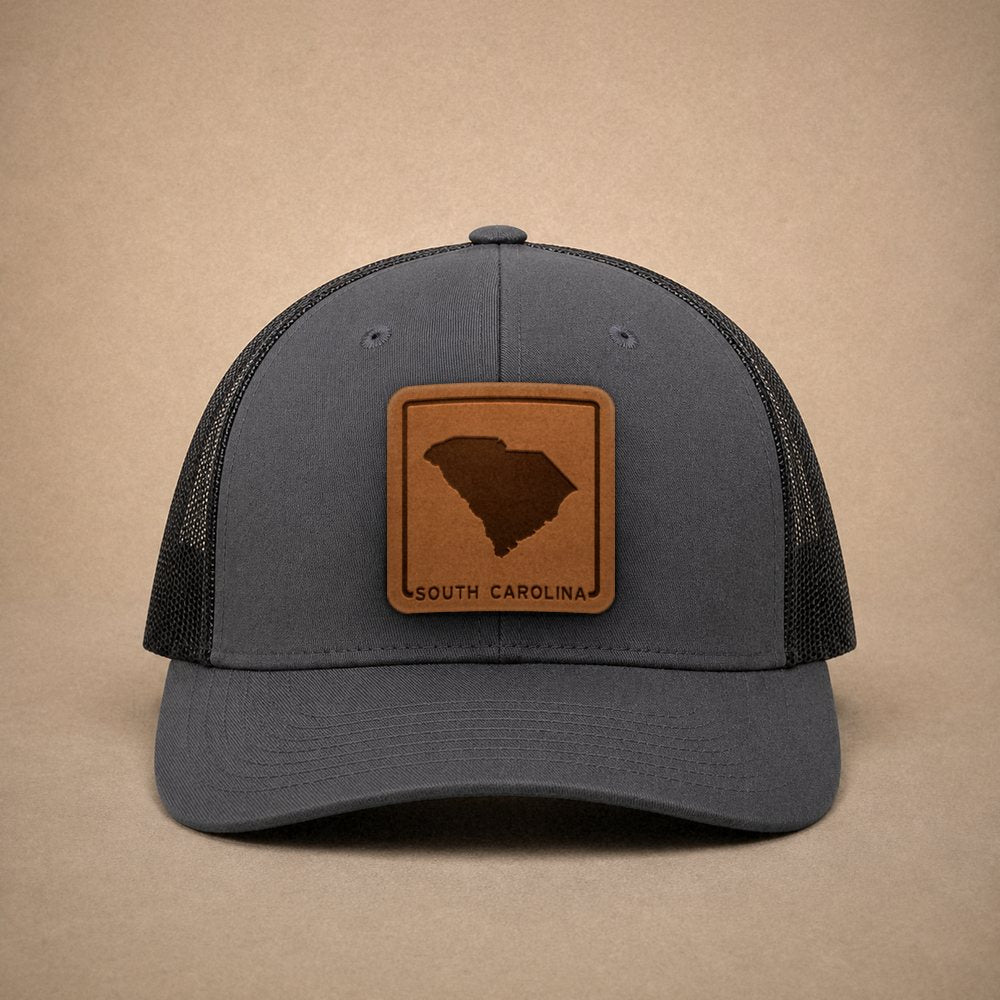 Charcoal South Carolina hats — South Carolina Outline Leather Patch Trucker Hat