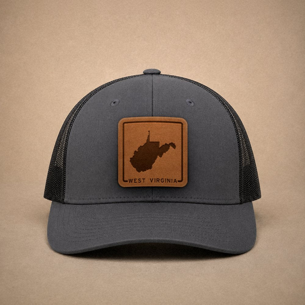 Charcoal West Virginia hats — West Virginia Outline Leather Patch Trucker Hat