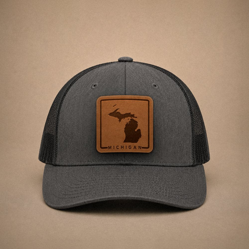 Dark Heather Grey Michigan hats — Michigan Outline Leather Patch Trucker Hat
