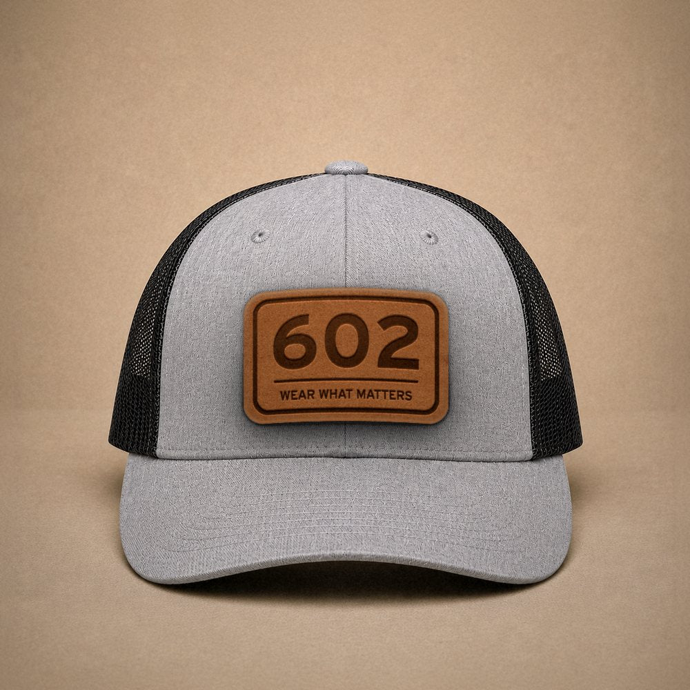 Heather Grey Phoenix hats — Phoenix 602 Leather Patch Trucker Hat
