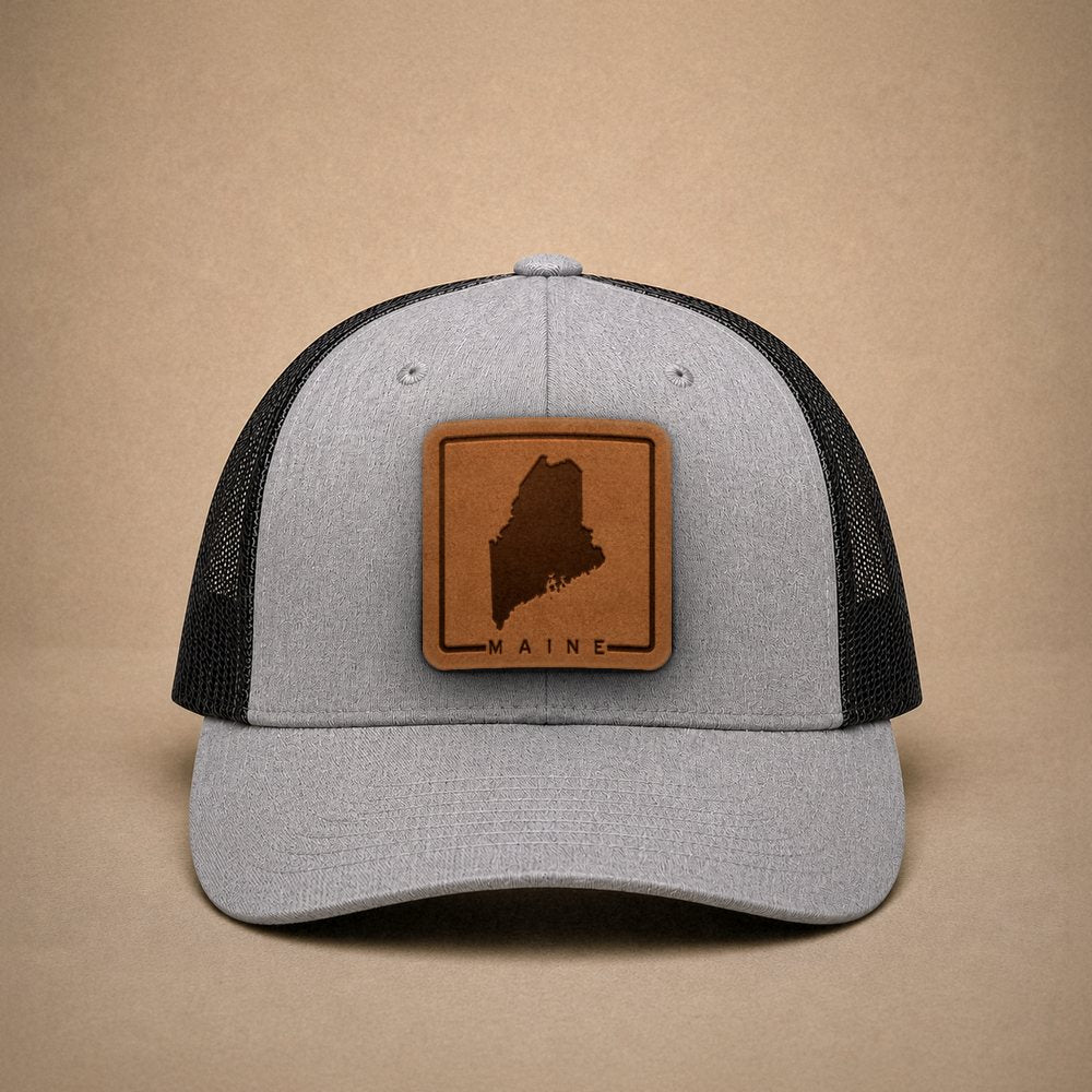 Heather Grey Maine hats — Maine Outline Leather Patch Trucker Hat