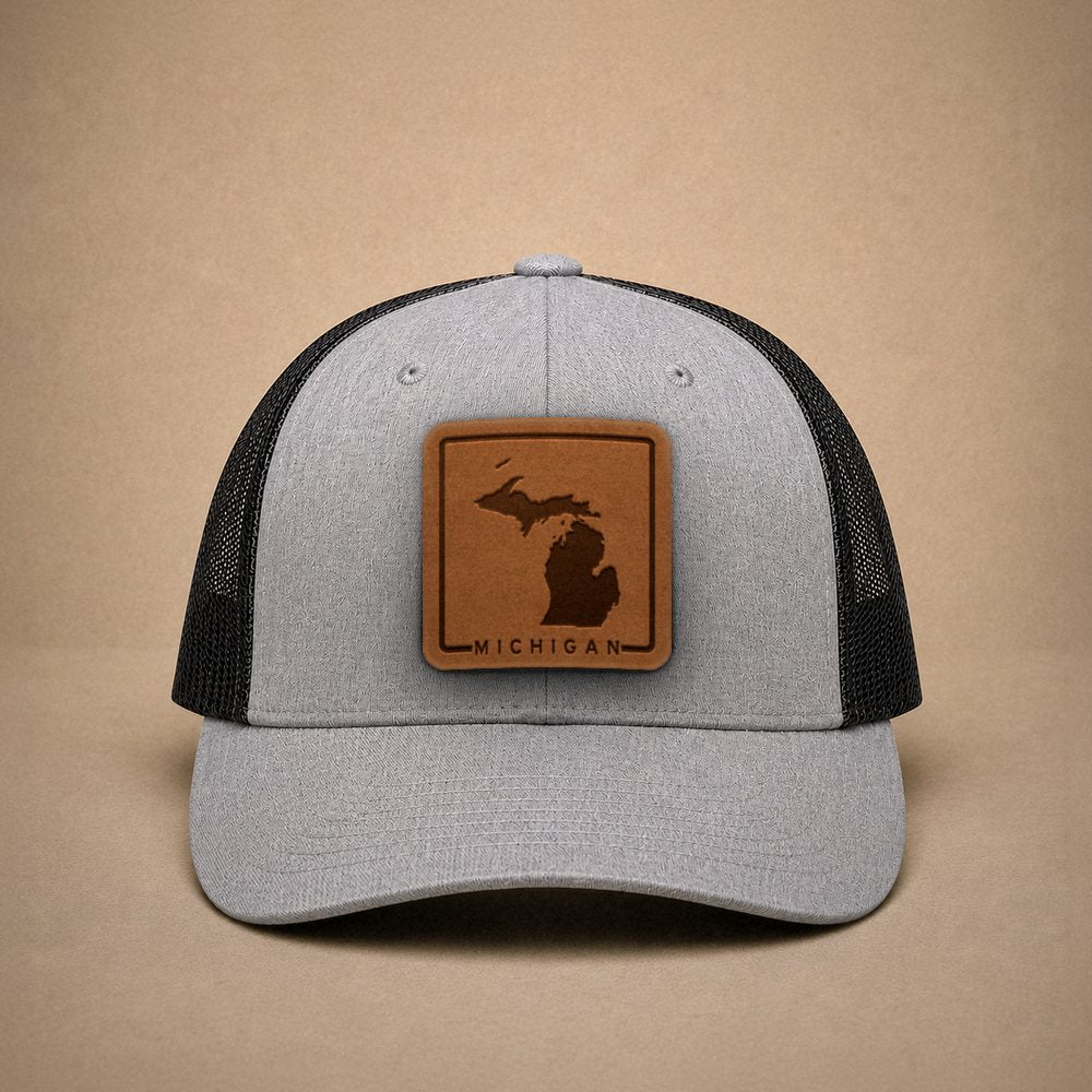 Heather Grey Michigan hats — Michigan Outline Leather Patch Trucker Hat