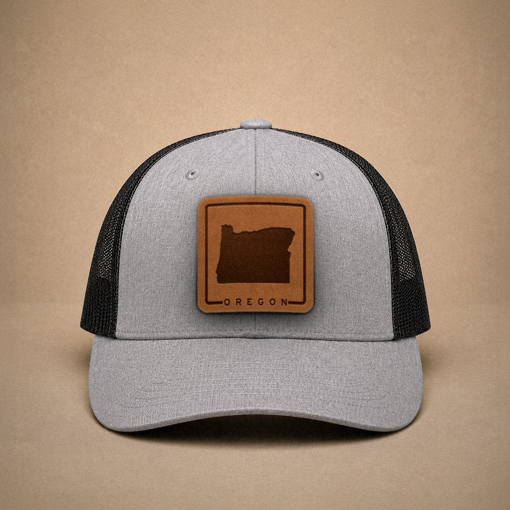 Heather Grey Oregon hats — Oregon Outline Leather Patch Trucker Hat