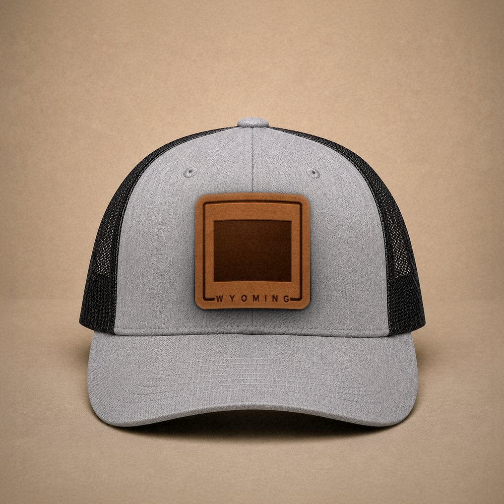 Heather Grey Wyoming hats — Wyoming Outline Leather Patch Trucker Hat