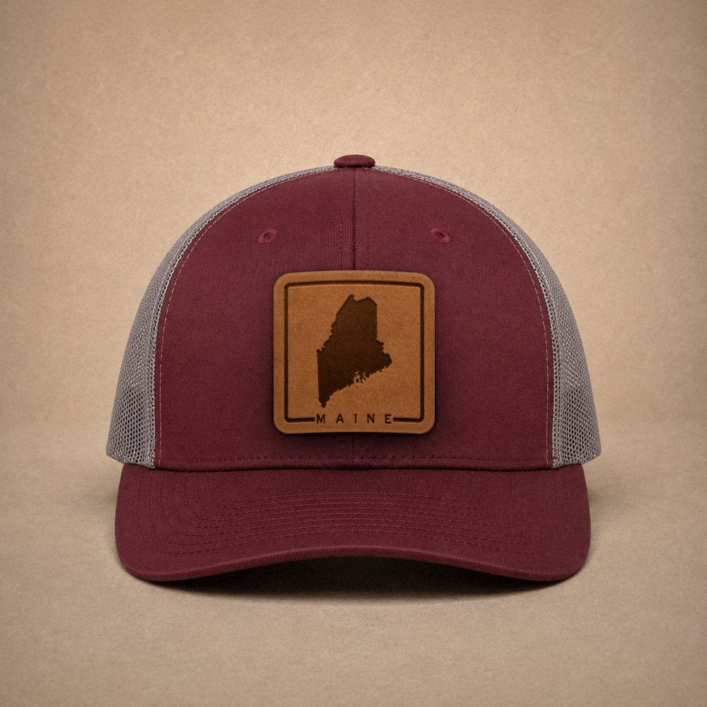 Maroon Maine hats — Maine Outline Leather Patch Trucker Hat