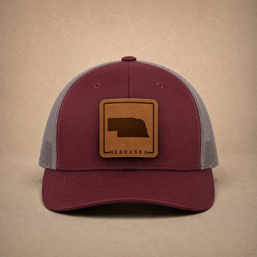 Maroon Nebraska hats — Nebraska Outline Leather Patch Trucker Hat