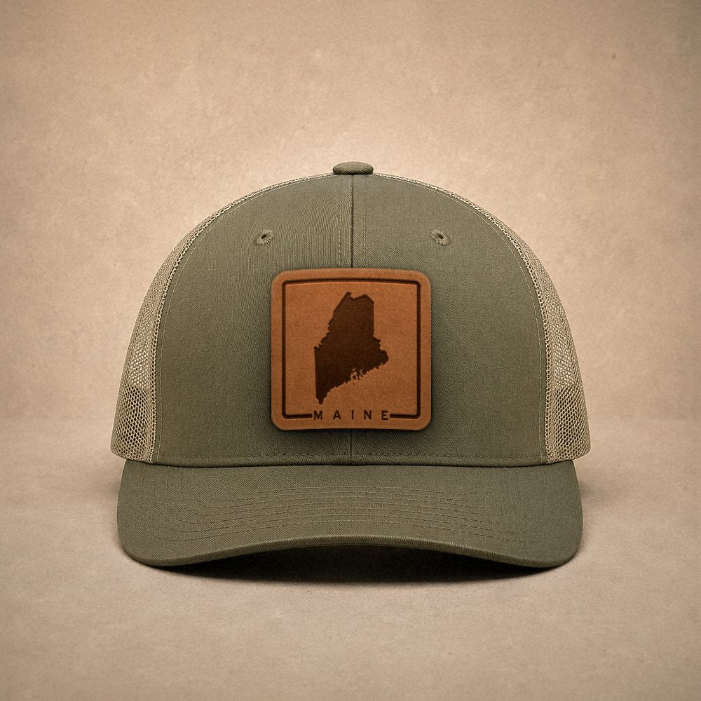 Moss Maine hats — Maine Outline Leather Patch Trucker Hat