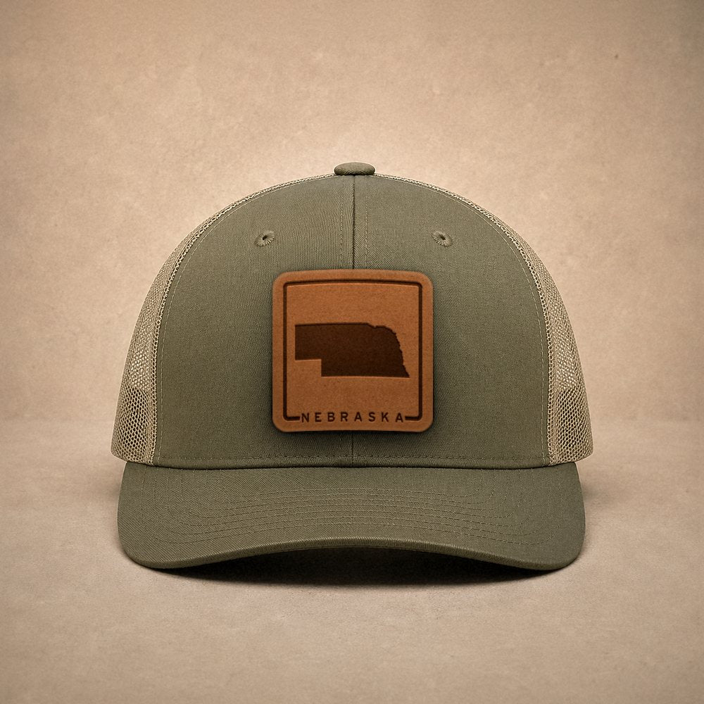 Moss Nebraska hats — Nebraska Outline Leather Patch Trucker Hat