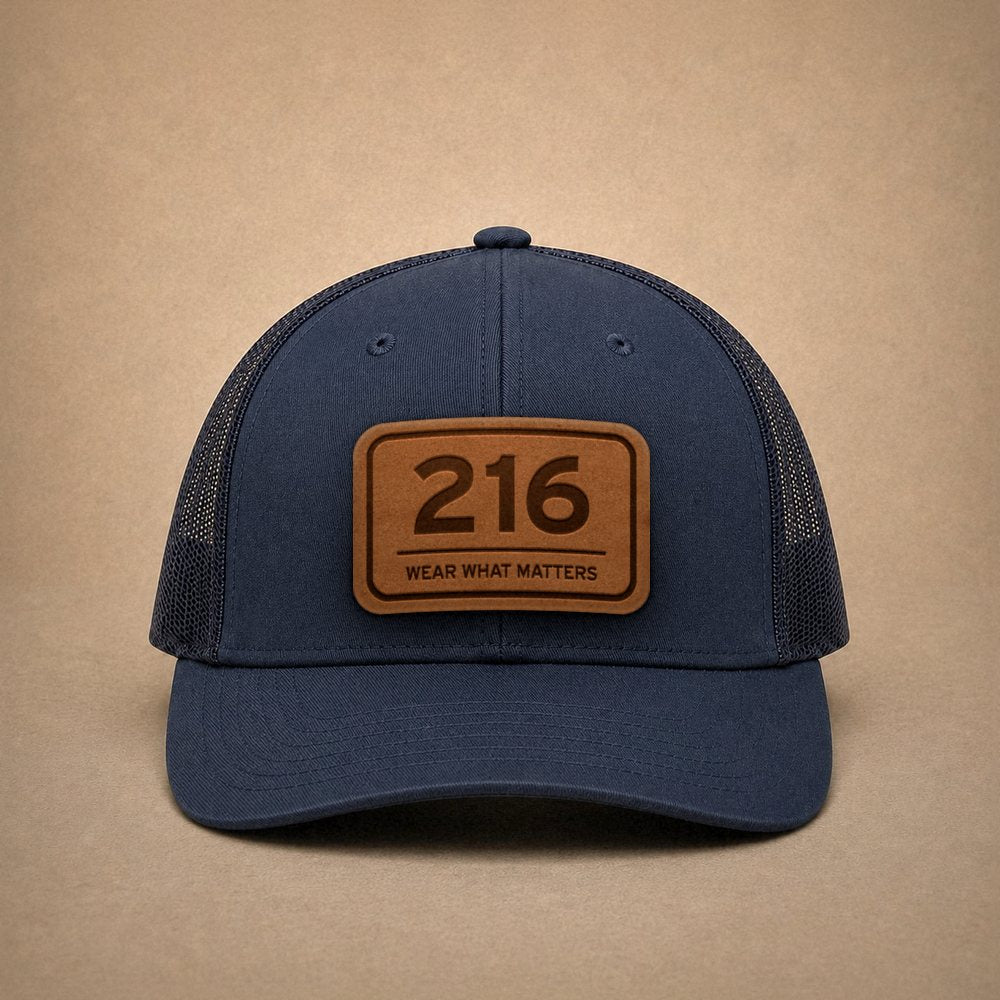 Navy Cleveland hats — Cleveland 216 Leather Patch Trucker Hat