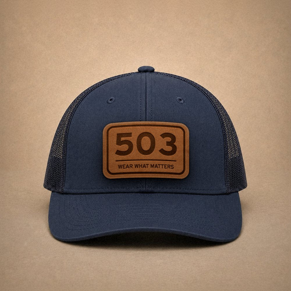 Navy Portland hats — Portland 503 Leather Patch Trucker Hat