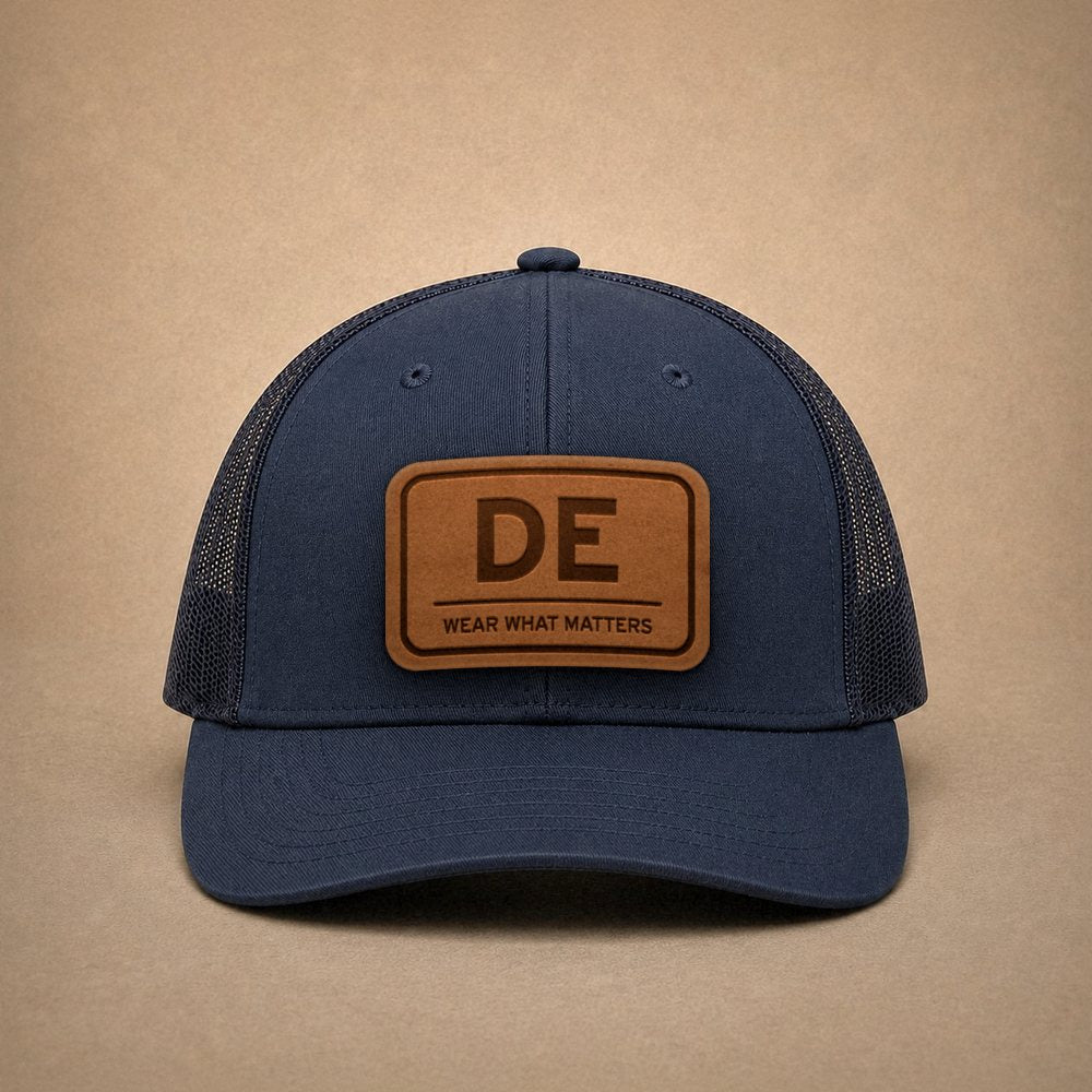 Navy Delaware hats — Delaware DE Leather Patch Trucker Hat