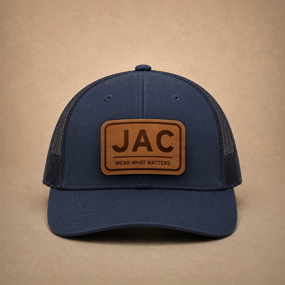 Navy Jackson Hole hats — Jackson Hole JAC Leather Patch Trucker Hat