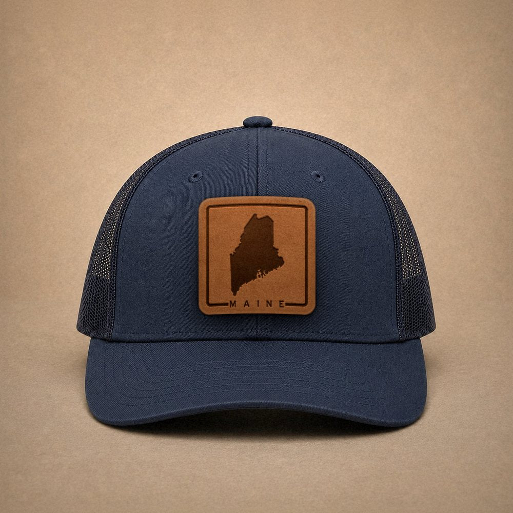 Navy Maine hats — Maine Outline Leather Patch Trucker Hat