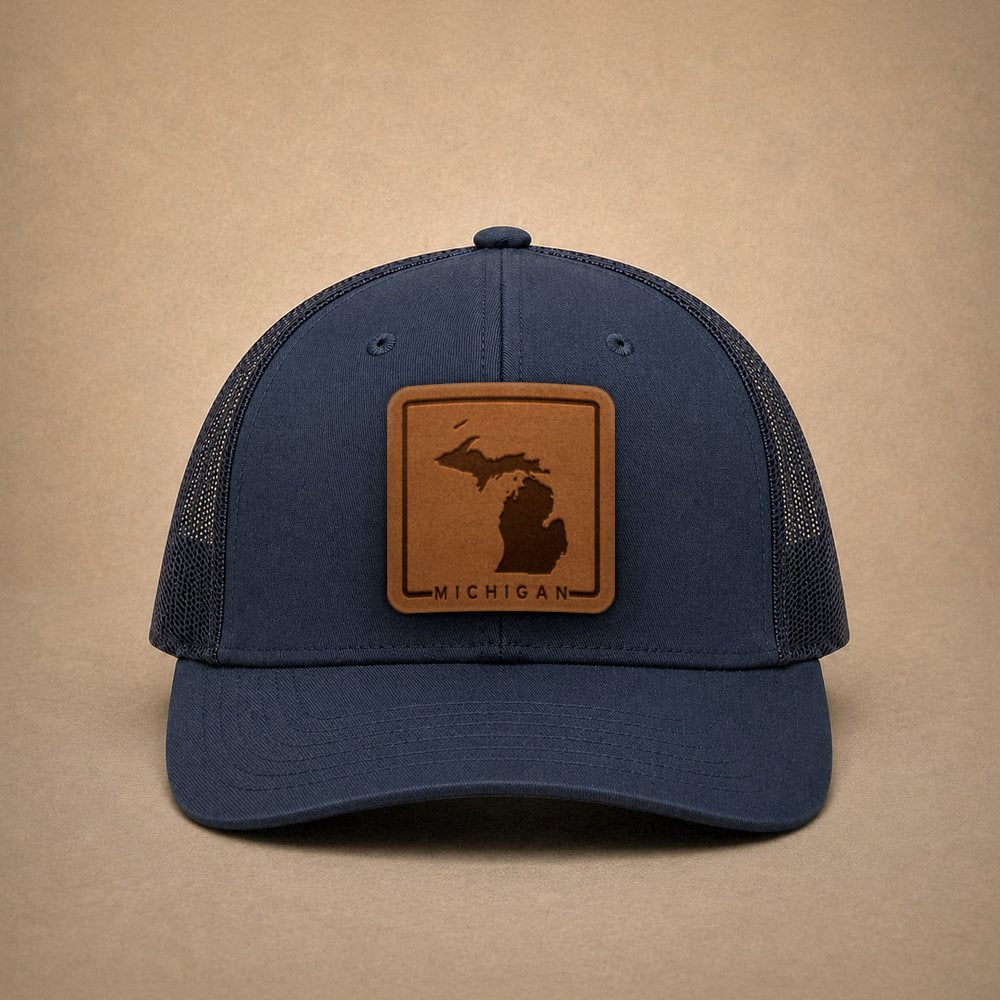 Navy Michigan hats — Michigan Outline Leather Patch Trucker Hat