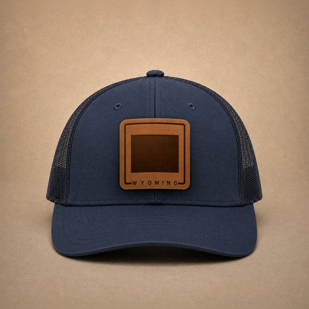 Navy Wyoming hats — Wyoming Outline Leather Patch Trucker Hat