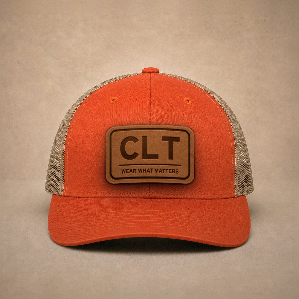 Orange Charlotte hats — Charlotte CLT Leather Patch Trucker Hat