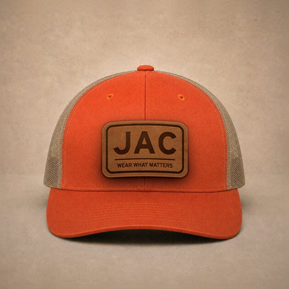 Orange Jackson Hole hats — Jackson Hole JAC Leather Patch Trucker Hat