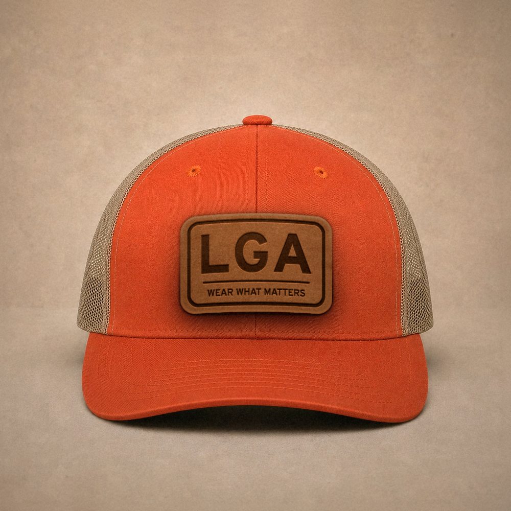 Orange New York City hats — New York City LGA Leather Patch Trucker Hat