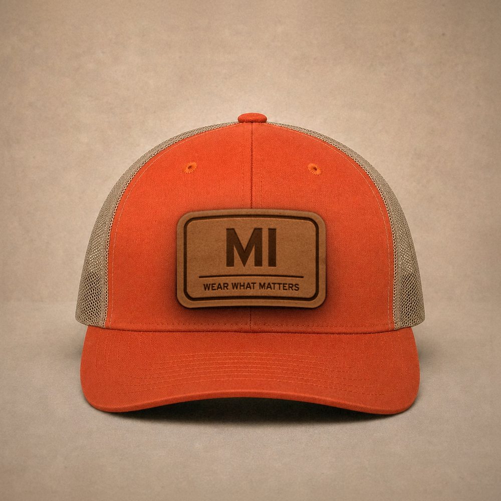 Orange Michigan hats — Michigan MI Leather Patch Trucker Hat