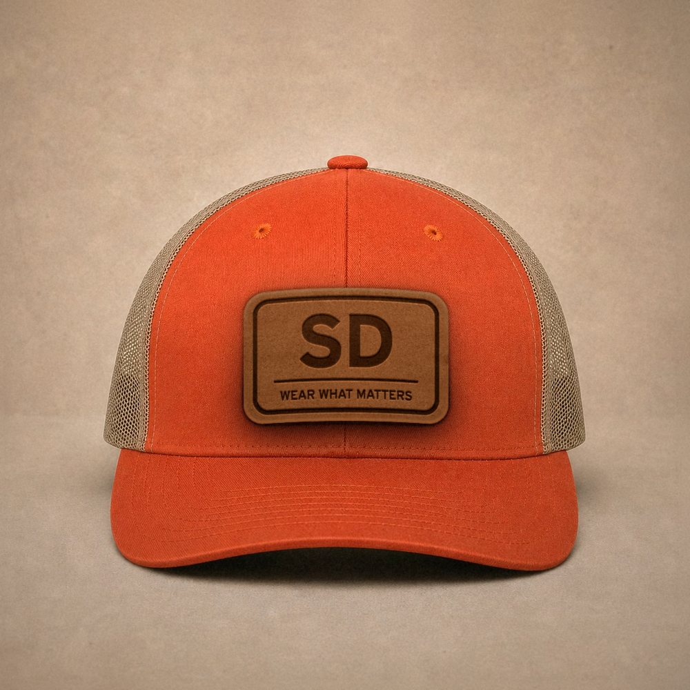 Orange South Dakota hats — South Dakota SD Leather Patch Trucker Hat