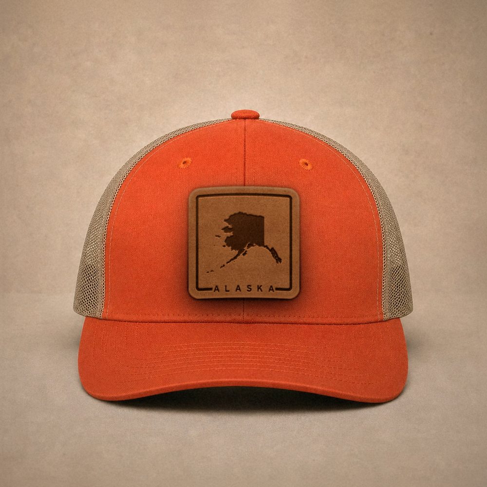 Orange Alaska hats — Alaska Outline Leather Patch Trucker Hat