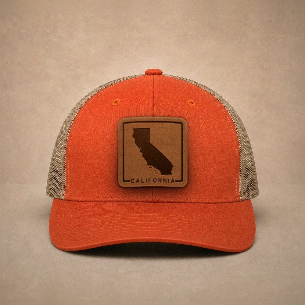 Orange California hats — California Outline Leather Patch Trucker Hat