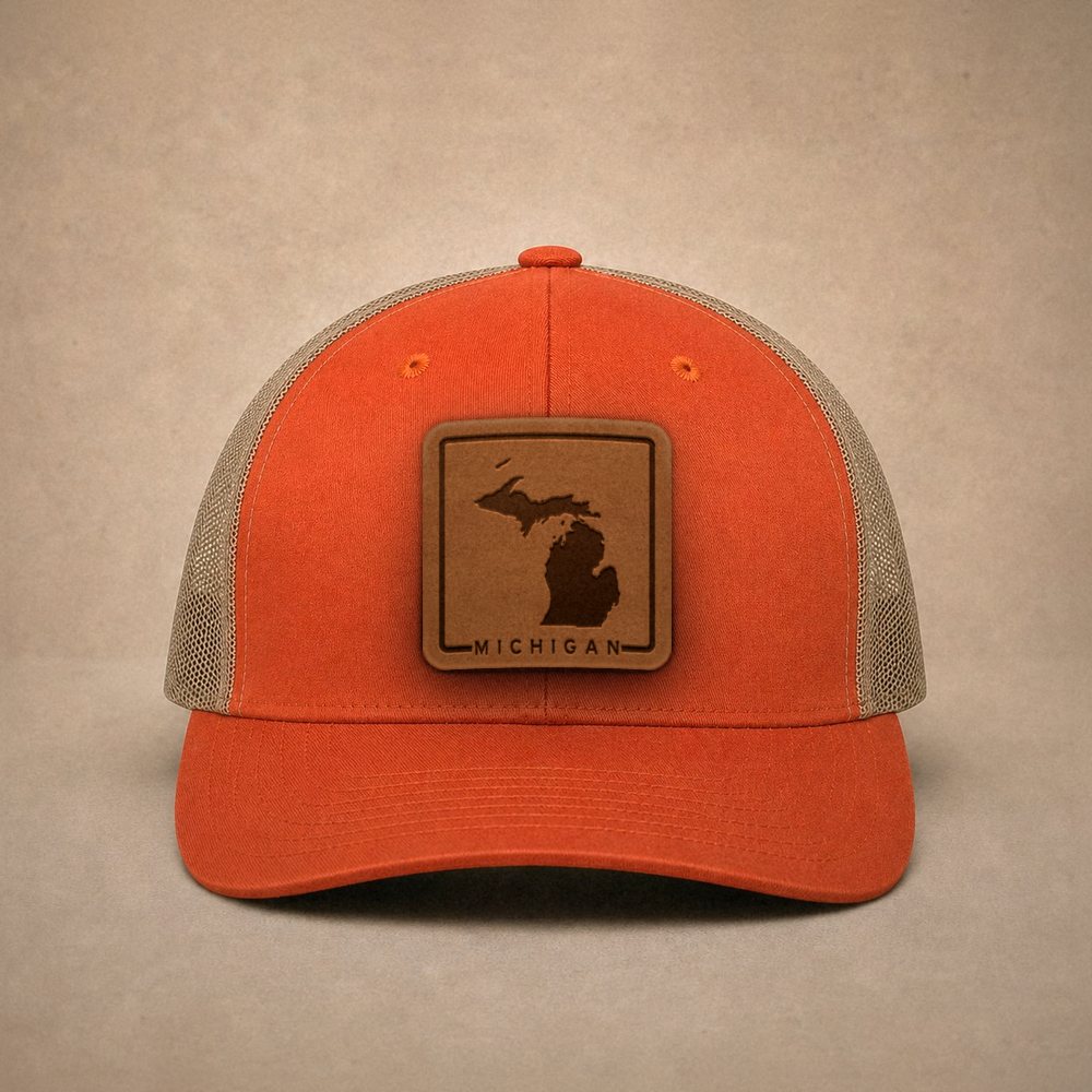 Orange Michigan hats — Michigan Outline Leather Patch Trucker Hat