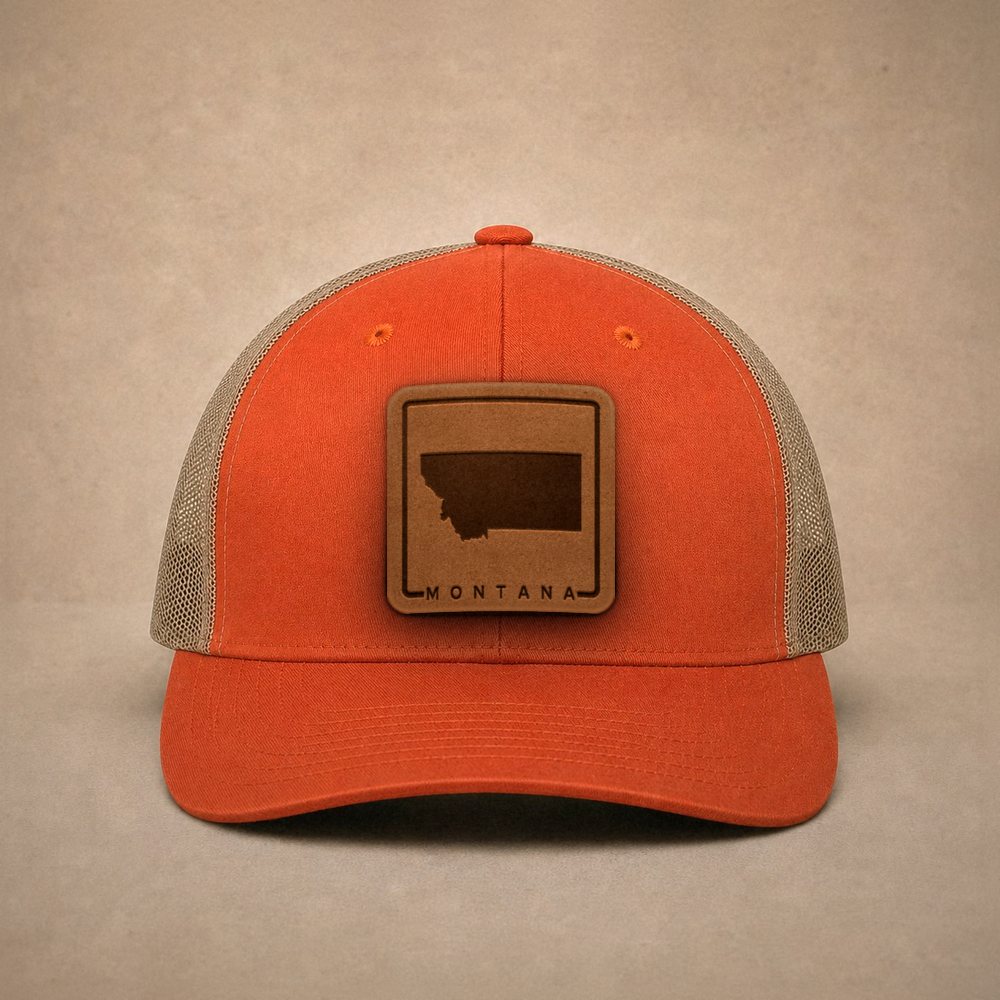 Orange Montana hats — Montana Outline Leather Patch Trucker Hat
