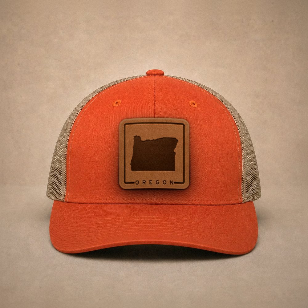 Orange Oregon hats — Oregon Outline Leather Patch Trucker Hat