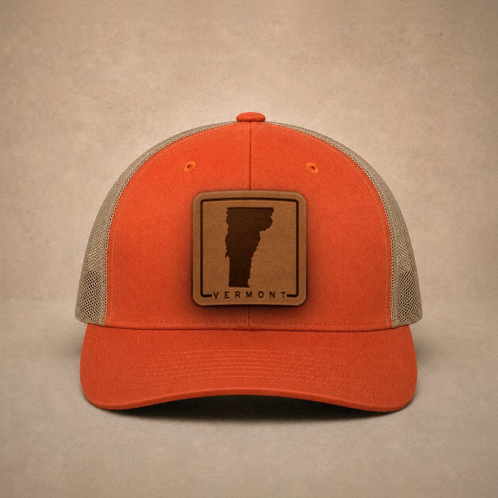 Orange Vermont hats — Vermont Outline Leather Patch Trucker Hat