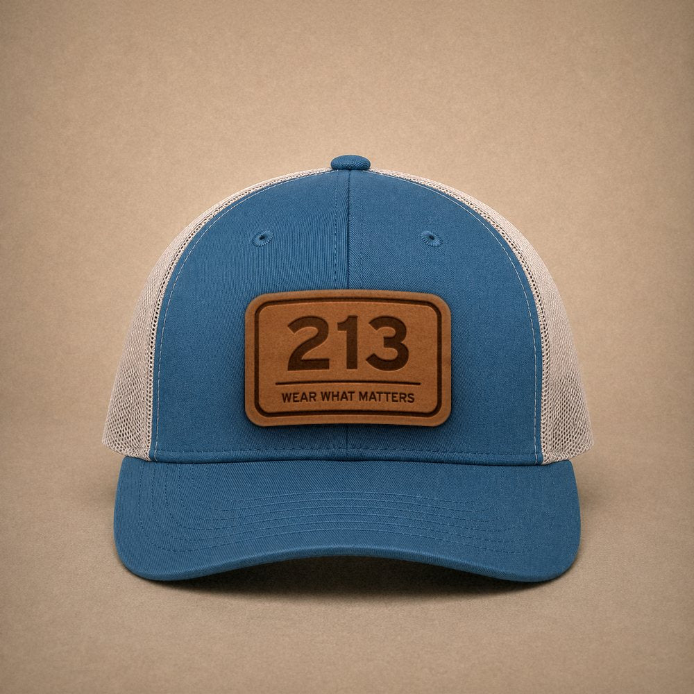 Steel Blue Los Angeles hats — Los Angeles 213 Leather Patch Trucker Hat