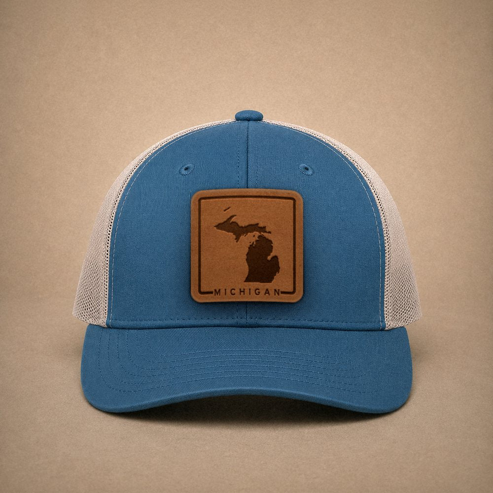 Steel Blue Michigan hats — Michigan Outline Leather Patch Trucker Hat